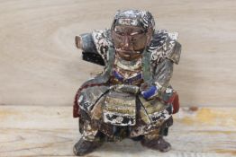 AN EARLY SEATED POLYCHROME FIGURE OF A SEATED SAMURAI