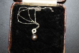 A 9ct WHITE GOLD DIAMOND AND PEARL PENDANT NECKLACE