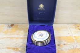 A BOXED HALCYON DAYS ENAMEL AND GILT METAL PAPERWEIGHT