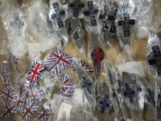 A LARGE COLLECTION OF NEW MORGAN CAR BADGES ETC