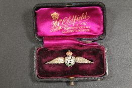 A SILVER GILT AN ENAMEL R.A.F. BROOCH IN BOX