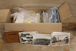 A TRAY OF SOUVENIR POSTCARDS ETC