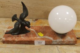 AN ART DECO STYLE TABLE LAMP WITH A SEA BIRD ON THE CREST OF A WAVE