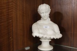 A SMALL ALABASTER STYLE BUST OF A LADY