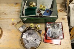 A COIN COLLECTION CONTAINED WITHIN A GREEN BANKING TIN