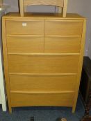 A MODERN OAK SEVEN DRAWER CHEST W 87 CM