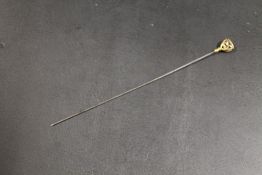 A VINTAGE PIERCED HAT PIN