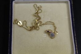 A HALLMARKED 10ct GOLD DIAMOND CLUSTER PENDANT NECKLACE