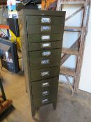 A TEN DRAWER STEEL TOOL CABINET WITH CONTENTS