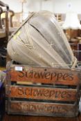 A VINTAGE WOODEN SCHWEPPES CRATE TOGETHER WITH A WICKER STYLE BASKET
