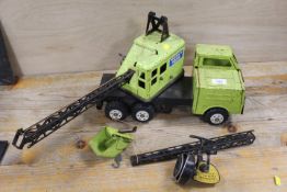 A VINTAGE TIN MOBILE CRANE TRUCK TOGETHER WITH A VINTAGE CLOSED FACED FISHING REEL