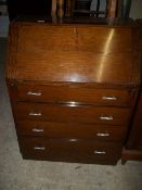 AN OAK MID CENTURY BUREAU