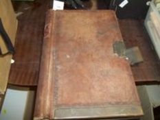 A VINTAGE ACCOUNTS BOOK WITH BRASS CLASP