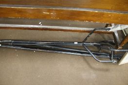 A METAL CLOTHES RAIL ON CASTORS