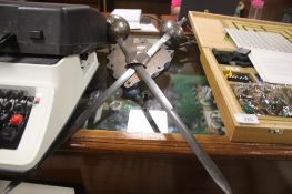 A CROSS SWORD WALL PLAQUE WITH A SILVER REED TYPEWRITER, A BOXED NEWLEC WALL LIGHT, A BOXED GAME SET