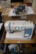 A BOXED JMB ELECTRIC SEWING MACHINE WITH POWER LEAD A/F