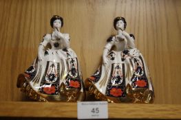 A PAIR OF ENGLISH MADE FINE BONE CHINA IMARI PATTERN LADY FIGURINES