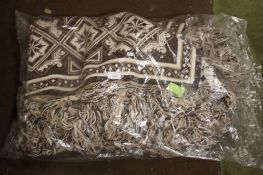 A LARGE BROWN/CREAM THROW