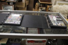 TWO STAMP ALBUMS CONTAINING BRITISH AND FOREIGN STAMPS