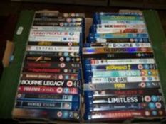 A TRAY OF DVDS AND BLUE RAYS