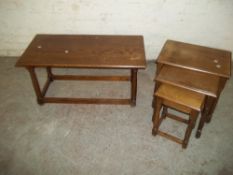 A OAK COFFEE TABLE AND AN OAK NEST OF 3 TABLES