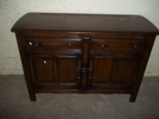 AN ERCOL STYLE DARK OAK SIDEBOARD