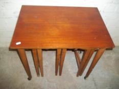 A RETRO TEAK NEST OF 4 TABLES