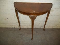 A WALNUT DEMI-LUNE CONSOLE TABLE