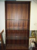 A LARGE GLASS SHELVED SHOP DISPLAY UNIT