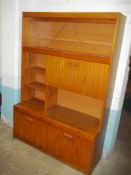 A RETRO TEAK WALL DISPLAY UNIT/CUPBOARD
