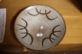 A LARGE SIGNED POTTERY BOWL