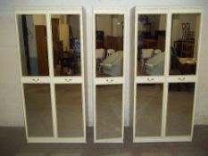 A FIVE DOOR MIRRORED WARDROBE BEDROOM SUITE