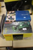 A BOSCH PH01582 PLANER TOGETHER WITH A NEWPOWER BELT SANDER WITH A ROLL OF SHEETS A/F
