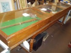 A TRIPLE SHOP JEWELLERY DISPLAY COUNTER ON LEGS WITH LIFT UP TOP (BY ROSTRUM)