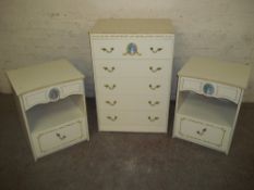 A LOUIS STYLE FIVE DRAWER CHEST OF DRAWERS AND TWO MATCHING BEDSIDE CABINETS