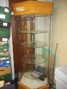 A ROTATING HEXAGONAL SHOP DISPLAY CABINET (FOYER)