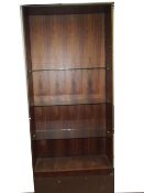 A LARGE GLASS SHELVED SHOP DISPLAY UNIT