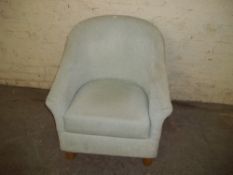 A MODERN BEDROOM TUB CHAIR