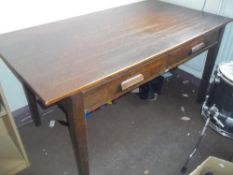 AN ANTIQUE TWO DRAWER OAK DESK