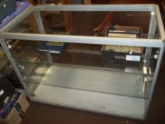 A ALUMINIUM FRAMED GLASS SHOP DISPLAY COUNTER