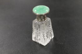 A SILVER AND ENAMEL MINIATURE SCENT BOTTLE