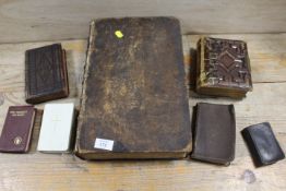 AN ANTIQUE FAMILY BIBLE DATED 1805 TOGETHER WITH A COLLECTION OF OTHER POCKET BIBLES ETC