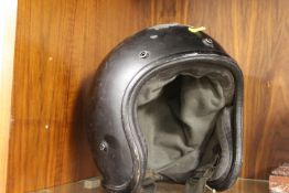 A VINTAGE MOTORCYCLE HELMET