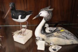 TWO MODERN WOODEN DISPLAY MODELS OF BIRDS TO INCLUDE A GREBE WITH THREE CHICKS