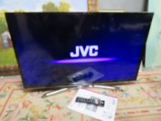 A JVC FLATSCREEN TV WITH REMOTE