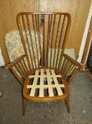 AN ERCOL COTTAGE SUITE ARMCHAIR