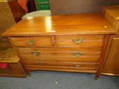 AN EDWARDIAN FOUR DRAWER CHEST OF DRAWERS