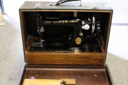 A VINTAGE CASED SINGER SEWING MACHINE