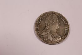 AN ANTIQUE SILVER THALA COIN