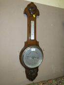 A SMALL OAK BAROMETER S/D
